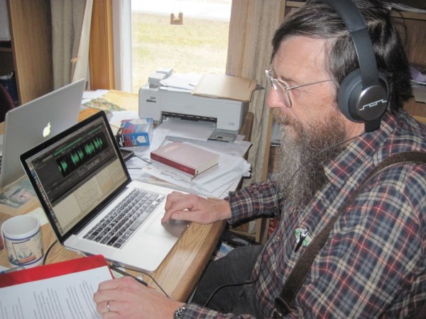 Bill listening to and editing the Gospel of Luke audio in Plains Cree